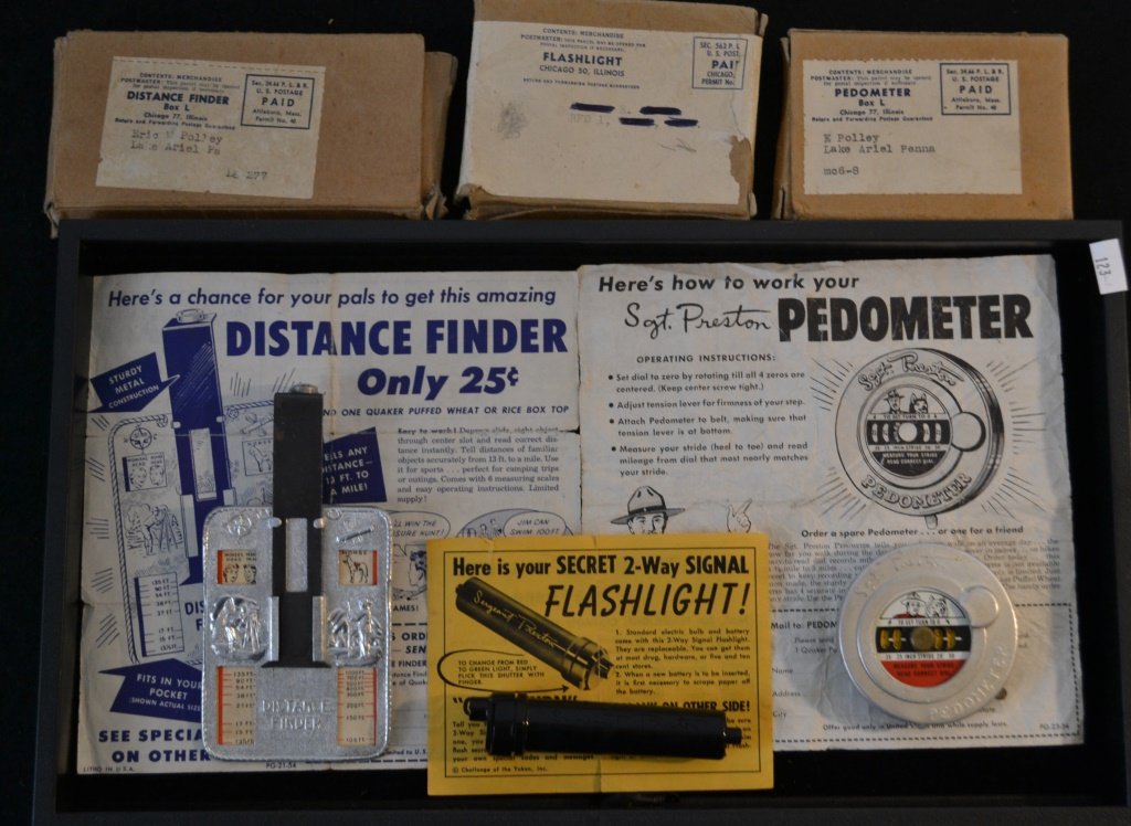 Quaker Puffed Wheat, Sargent Preston Premium Lot: Quaker Puffed Wheat, Sargent Preston premium lot including: 1955 distance finder w/ original box and advertisement, pedometer w/ original box and advertisement, and secret two way signal flashlight w/