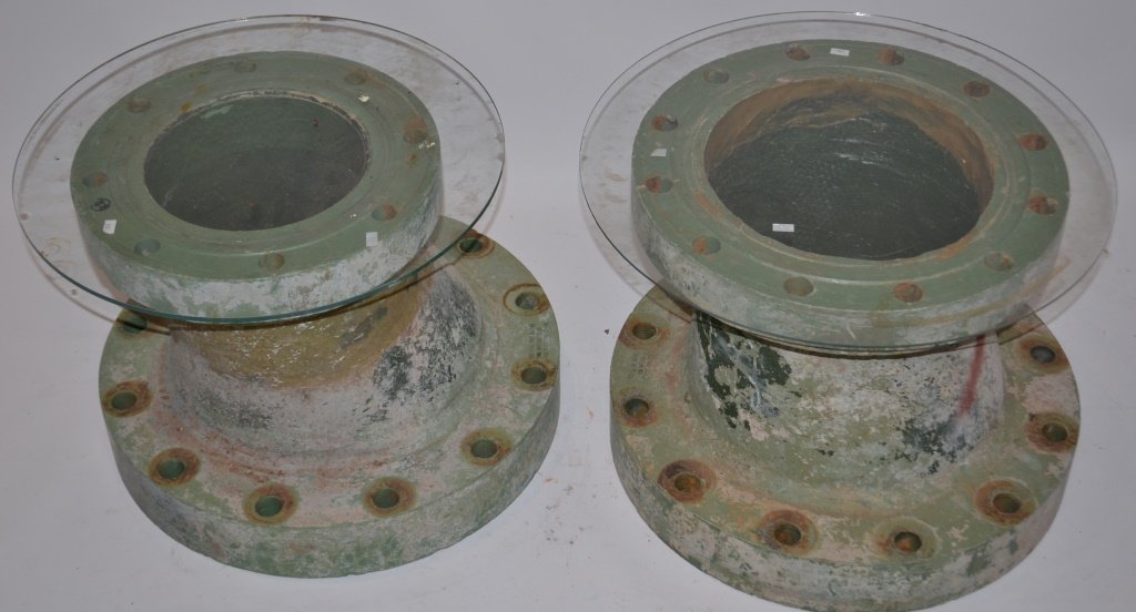 Pair of Fiber Glass Pipe Molds Made Into Tables: Pair of fiber glass pipe molds with glass added to make them into tables; each is slightly different; measuring approx 14 in H x 19 in diameter; great industrial look.