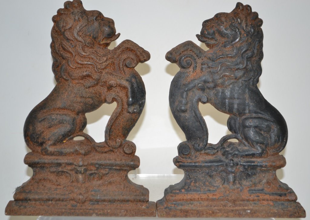 Pair of Cast Iron Lion Fireplace Accents: Pair of cast iron lion fireplace accents; measuring 14.5 in H