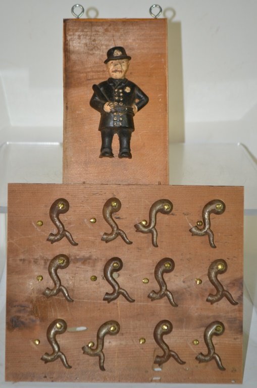 Collection of 12 Precussion Cap Gun Hammers: Collection of 12 precussion cap gun hammers includes 6 inch tall cast iron policeman also mounted on board