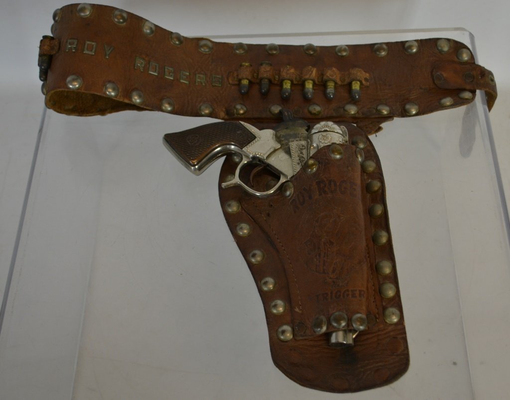 Early Roy Rogers Cap Gun & Leather Holster: Early Roy Rogers Cap Gun & Leather Holster, Cap gun has strong action, but loose hinge. Holster is in played w/ condition, missing one bullet