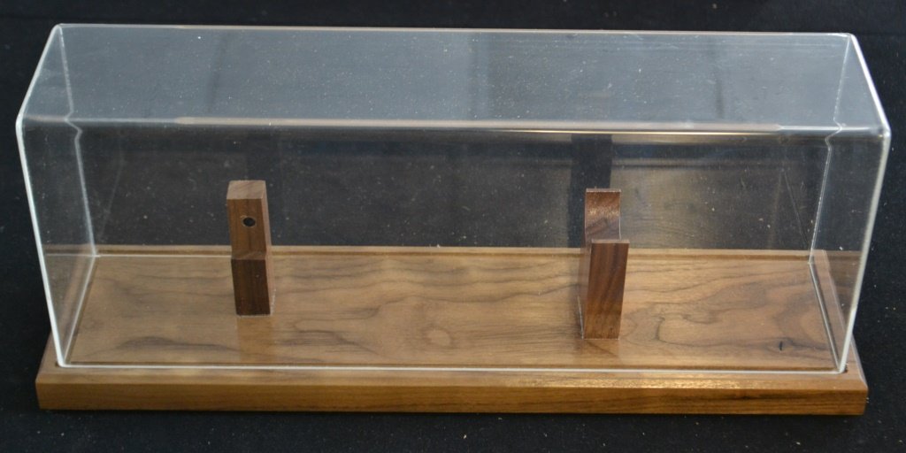 Acrylic Wood Bottom Magnetic Display Case: Acrylic Wood Bottom Magnetic Display Case for knife with solid natural wood bottom and acrylic cover held fast by magnets; 15.5 in L x 3.5 in H (space for knife - display includes riser stand built in