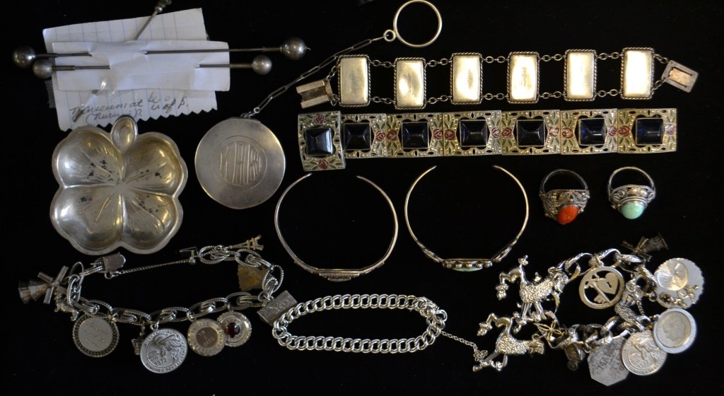 Collection of Mostly Sterling Silver Jewelry: Collection of Mostly Sterling Silver Jewelry including: 2 charm bracelets, 4 leaf clover ashtray, 2 mid western style bracelets, and rings, vintage compact on chain, 2 bracelets, Hat pins, attributed 