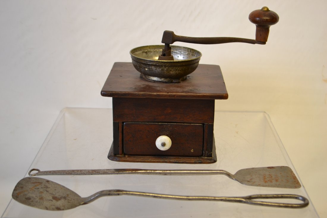 Collection of Pimitive Items: Collection of Pimitive Items including pair of iron spatulas and an early coffee grinder measuring 9" H x 7" x 7.25"