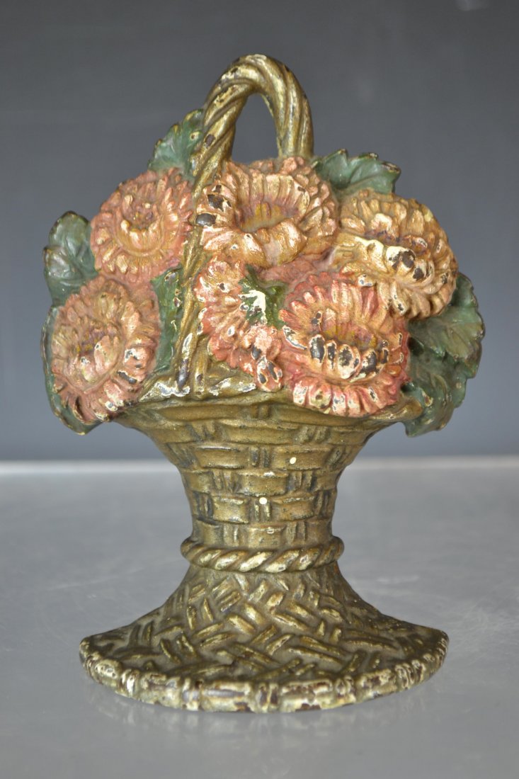 Cast Iron Floral Doorstop Waverly Studio 1925: Cast Iron Floral Doorstop Waverly Studio 1925 - marked on back "Waverly Studio Wilmette ILL Copyright 1925"; in fair condition, some loss to paint; measures 6.5" H
