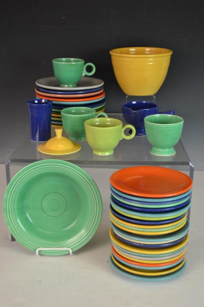Large Collection of Early Fiestaware: Large Collection of Early Fiestaware including 5 plates measuring 6.25", 12 plates measuring 7.25", 17 saucers measuring 6", 4 cups, gravy, beaker with rim chip at foot, yellow lid, 6.5" bowl