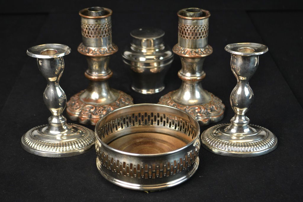 Old Sheffield Silver Plate Grouping: Old Sheffield Silver Plate Grouping including two pairs of candlesticks, (larger missing hurricane shade) - measuring 6.25" H, wine coaster, tea box