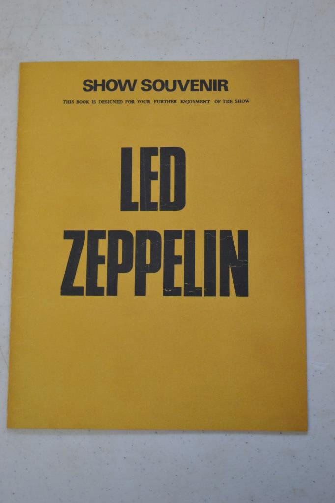 Led Zeppelin Full Band Autographed Show Souvenir: Led Zeppelin Full Band Autographed Show Souvenir, two page pamphlet describing band history with Jimmy Page, Robert Plant, John Bonham, & John Paul Jones autographs inside; some staining on inside edg