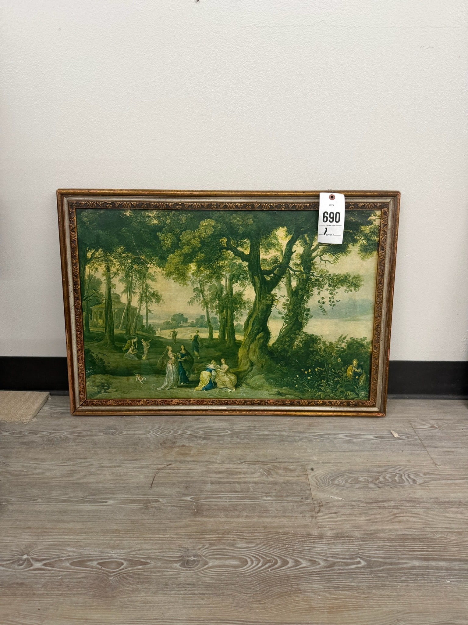 17th Century Flemish Wooded Landscape Painting: 17th century Flemish wooded landscape painting depicting a serene forest setting with figures and a distant view of a lake or river. Medium appears to be oil on canvas, housed in an ornate gold-toned 