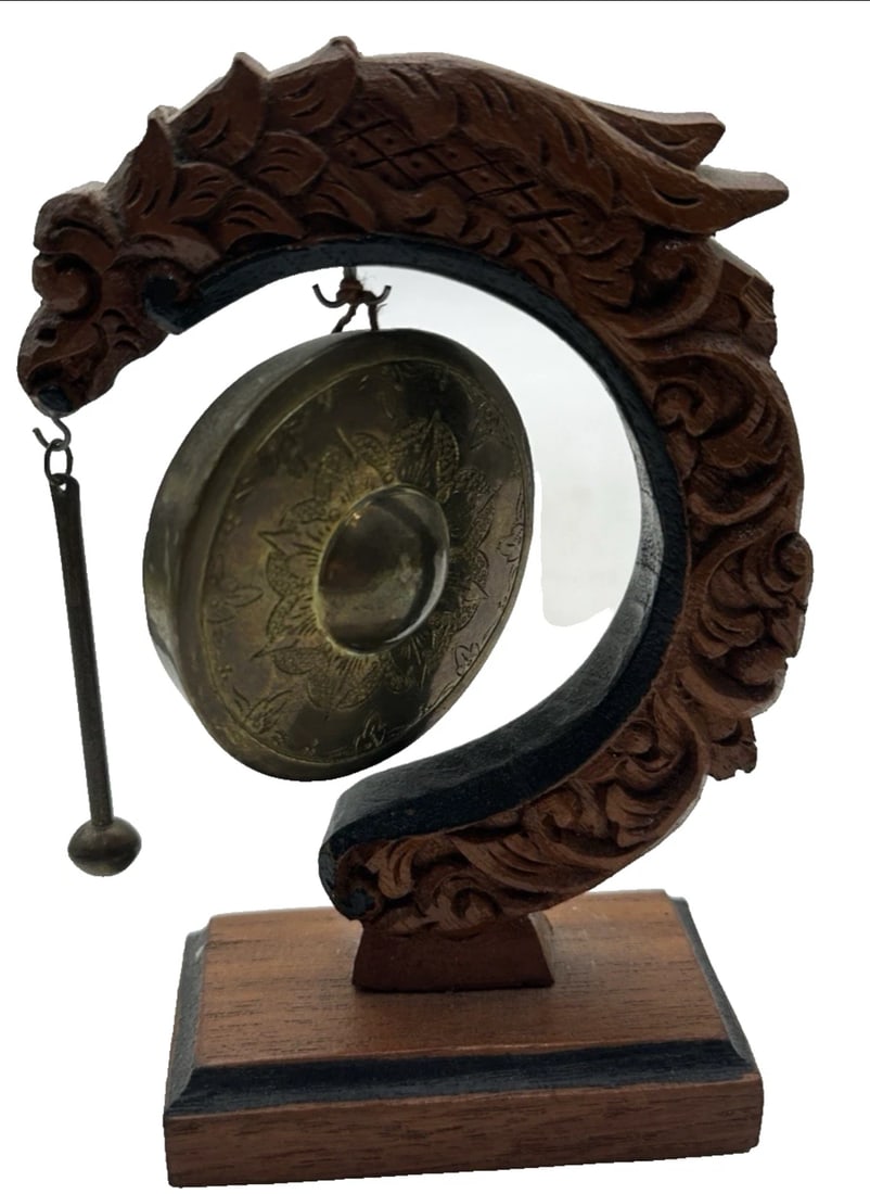 Dragon Shape Brass Dinner Caller: small Wood Hand Carved Lizard/Dragon Shape with Brass Dinner Caller with StickThe Antique Wood Hand Carved Lizard/Dragon Shape with Brass Gong is a unique and intricately crafted piece that makes a st