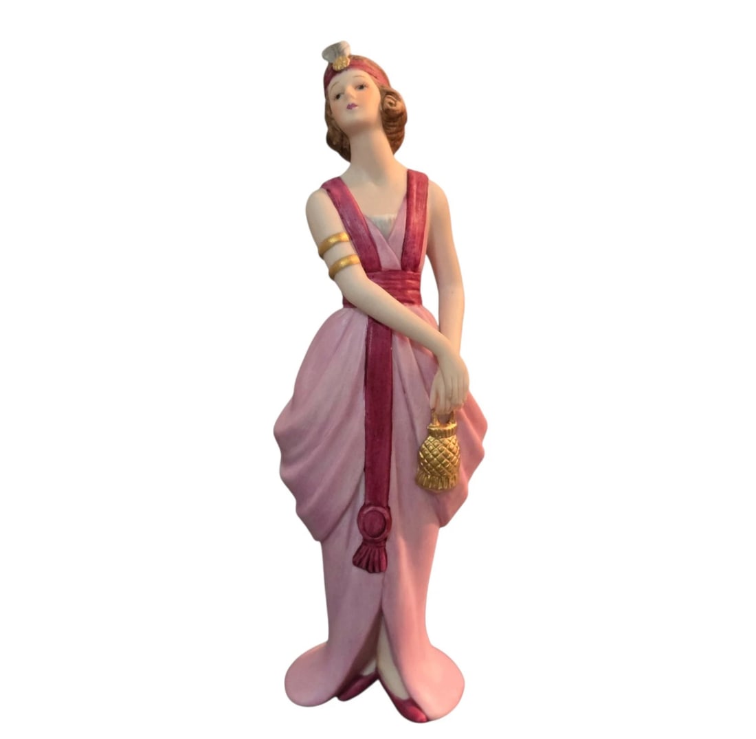 Vintage Lenox Porcelain Vanessa The Great Fashions of HIstory" 6 inches: This Vintage Lenox Porcelain Vanessa figurine from "The Great Fashions of History" collection features a detailed depiction of a woman in a Baroque/Rococo style outfit, showcasing the elegance and sop