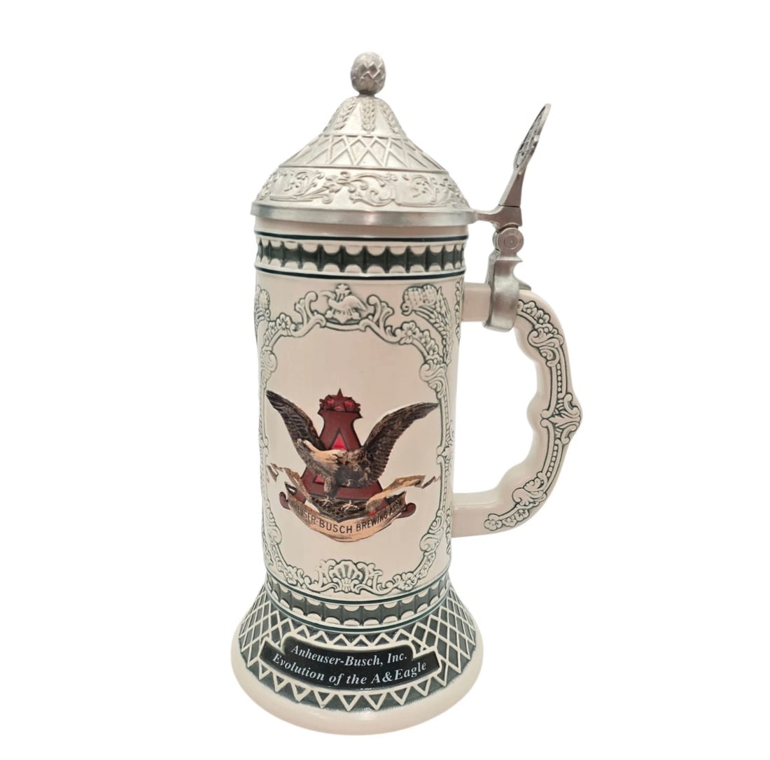2003 Anheuser-Busch Collectors Club "Evolution of the A&Eagle" Lidded Stein: Anheuser-Busch, Inc.2003 Edition / Evolution of the A&Eagle This highly collectible ceramic lidded beer stein was issued exclusively to members of the Anheuser-Busch Collectors Club. The center featur