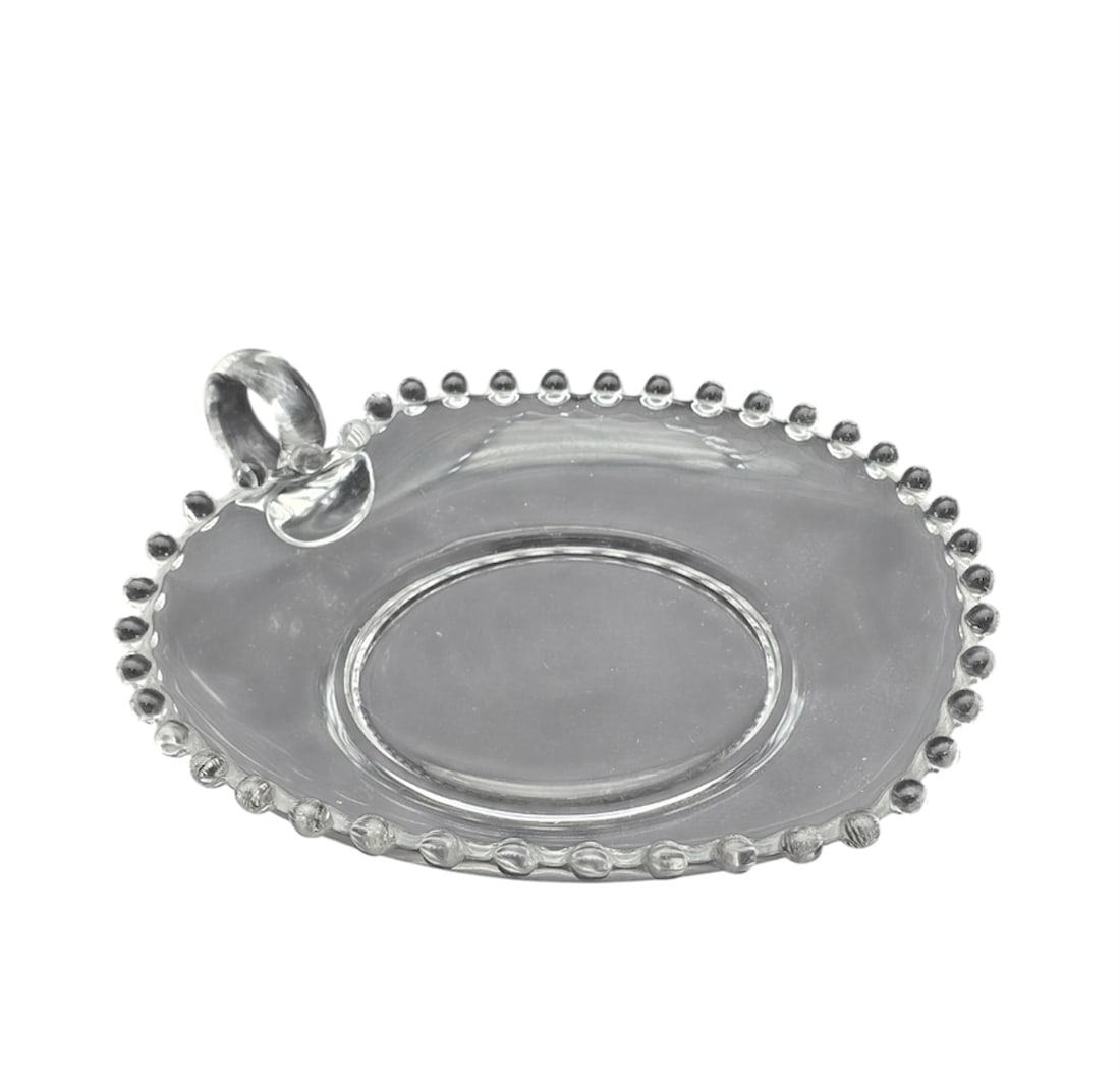 Vintage Imperial Glass Candlewick 6" Beaded Edge Heart Shaped Dish with Handle: A charming, shallow clear pressed glass serving dish or nappy bowl. It features a decorative beaded rim matching the style of the relish dish and is finished with an integrated single loop finger hand