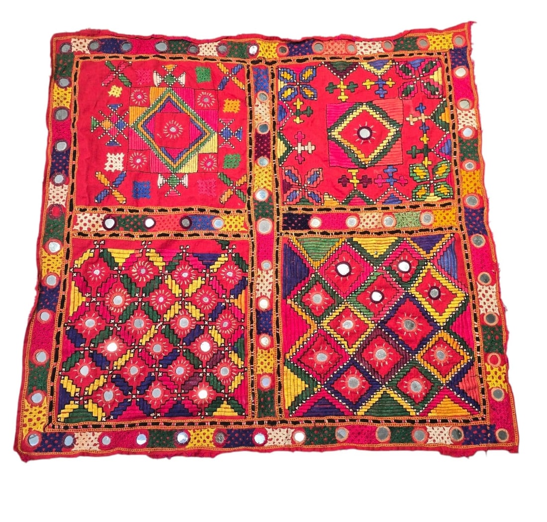 Asian Vintage Wall Hanging Mirror Work Tapestry Cloth Masterpiece: A striking, vibrant square textile panel featuring traditional Indian Shisha embroidery. Set on a rich red fabric base, the piece is split into four main geometric quadrants adorned with dense multi-c