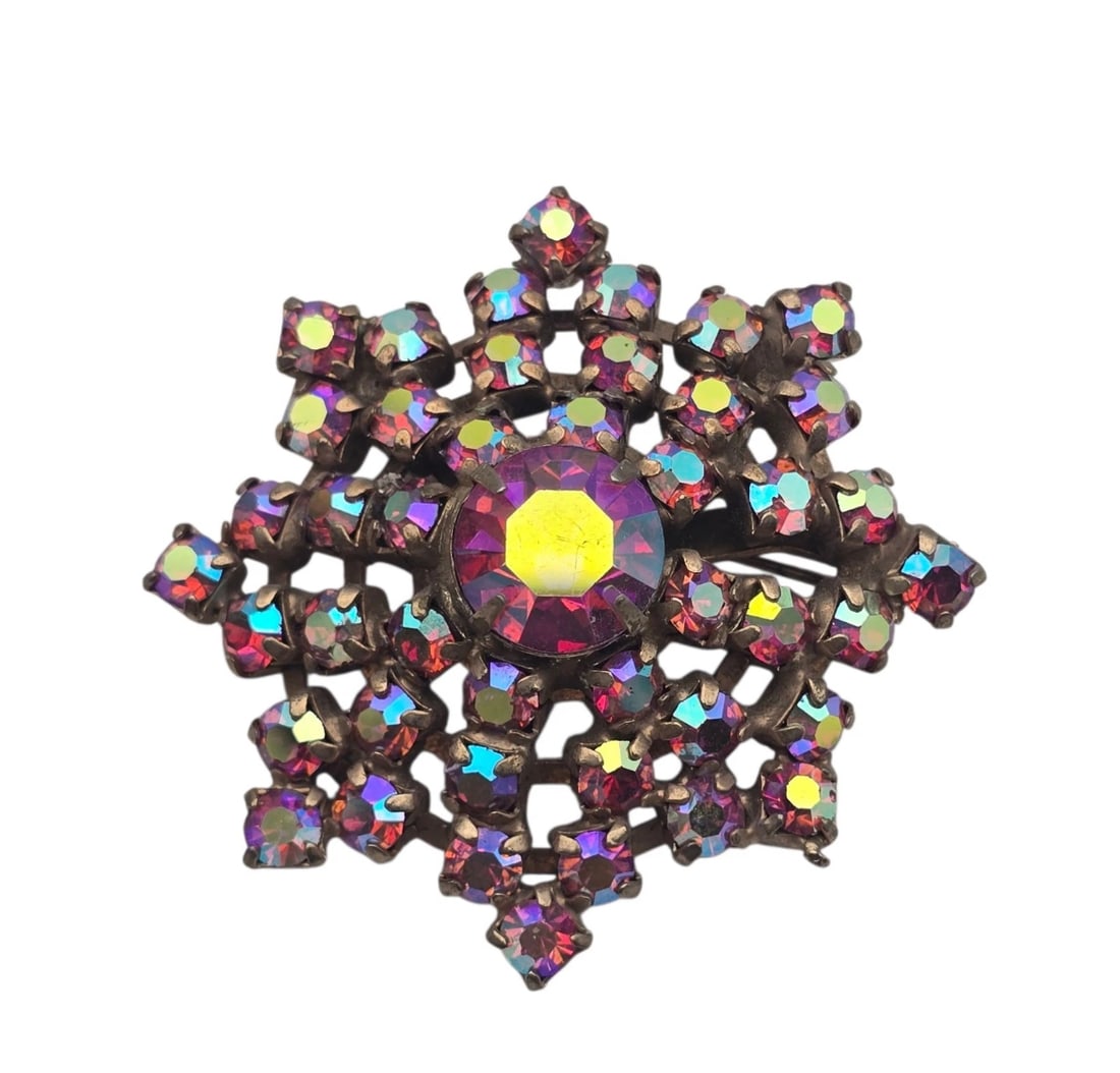 Vintage Aurora Borealis Rhinestone Brooch Pin Snowflake Starburst: Eye-catching starburst/snowflake design with a massive central fuchsia pink stone, surrounded by smaller, fiery Aurora Borealis (AB) rhinestones that shift colors in the light.