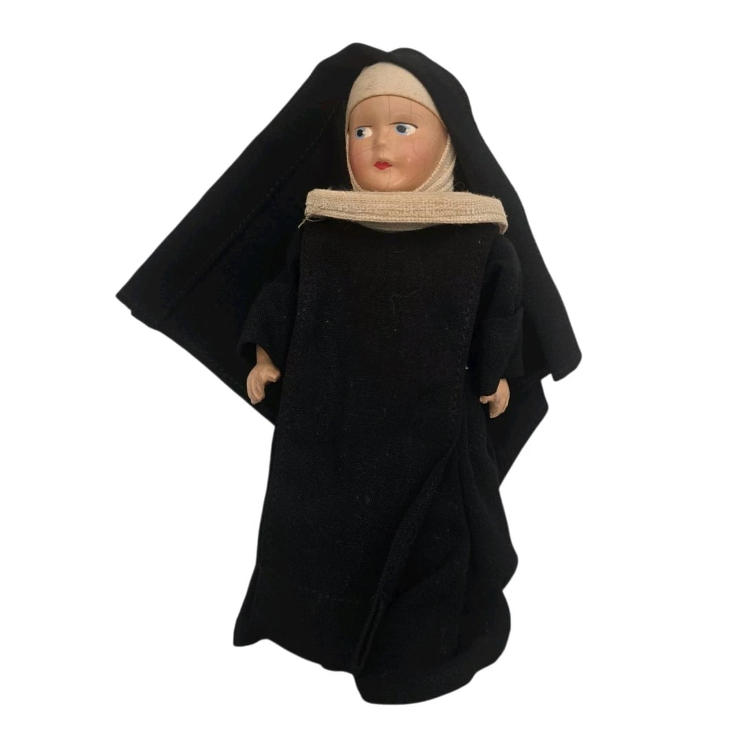 Antique Catholic Nun Doll With Full Habit Shoes & Closing Eyes: Charming vintage religious collector doll dressed in a traditional black and white Catholic nun habit. Features a finely detailed composition or hard plastic head with hand-painted facial features, in