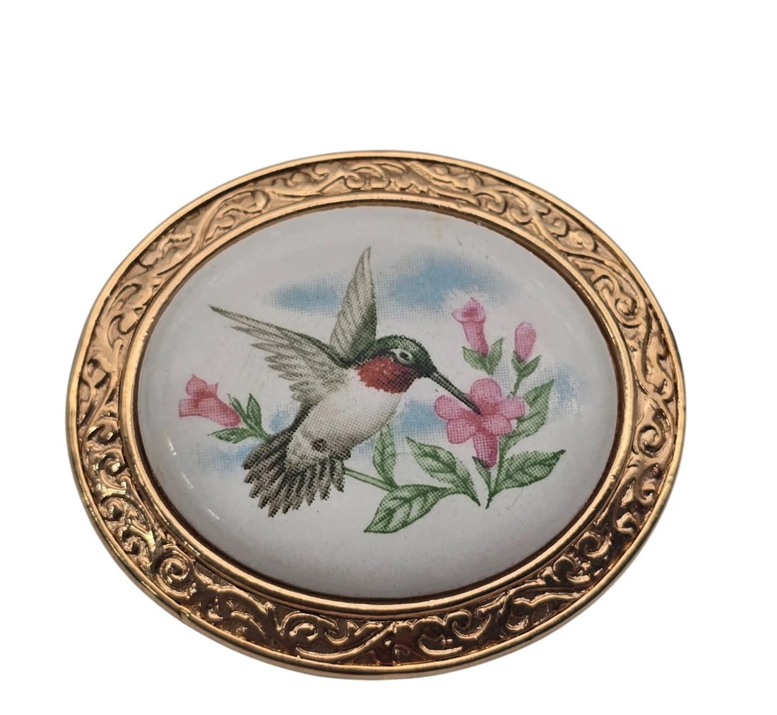 Hummingbird Brooch Pendant Avon Gold Tone Porcelain Summer Song: Beautiful vintage Victorian-revival oval picture brooch. Features a central porcelain or composite cabochon beautifully printed with a colorful, detailed illustration of a ruby-throated hummingbird ho