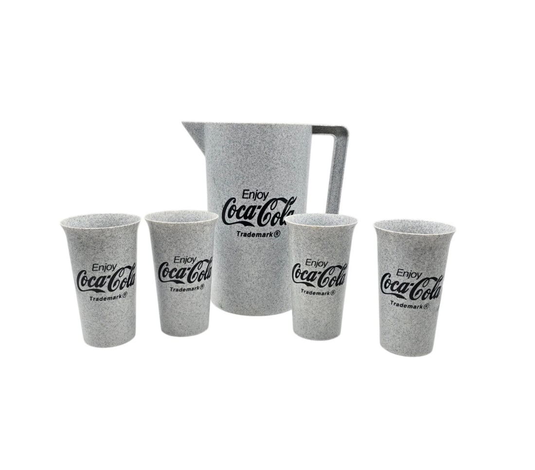 Vintage Coke Coca Cola Plastic Pitcher And 4 Glasses Set: Perfect for patio dining, picnics, or everyday nostalgia! This casual drinkware set features a distinct grey faux-granite speckled pattern. Every piece is stamped with the classic script logo: "Enjoy 