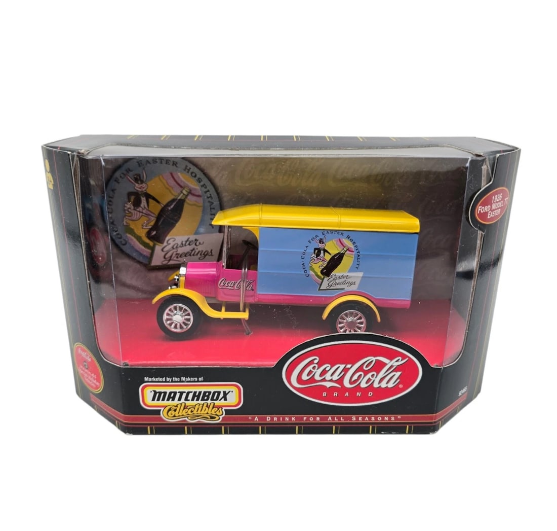 1999 MATCHBOX Collectibles Coca-Cola 1926 Ford Model TT Easter: A Drink For All Seasons" series, this premium die-cast model features a vibrant 1926 Ford Model TT Delivery Truck celebrating Easter. The truck sports a striking pink, yellow, and baby blue color sche