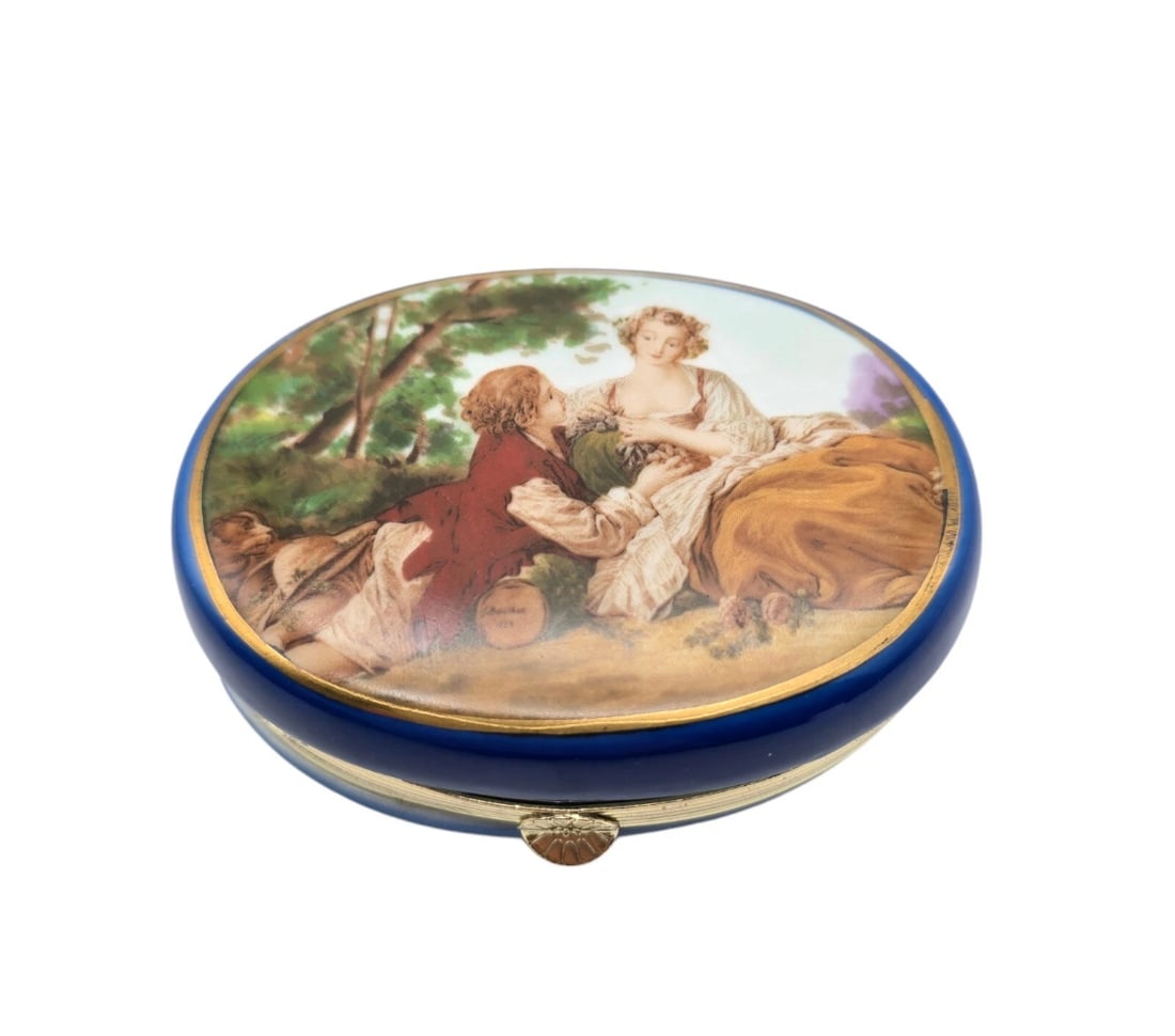 Attribute F Boucher Rococo Romantic Signed Porcelain Box: pocket-sized hinged trinket or pill box. The porcelain lid features a romantic, classical-era scene of a courting couple relaxing in a meadow based on historical pastoral artwork, framed by a delicate