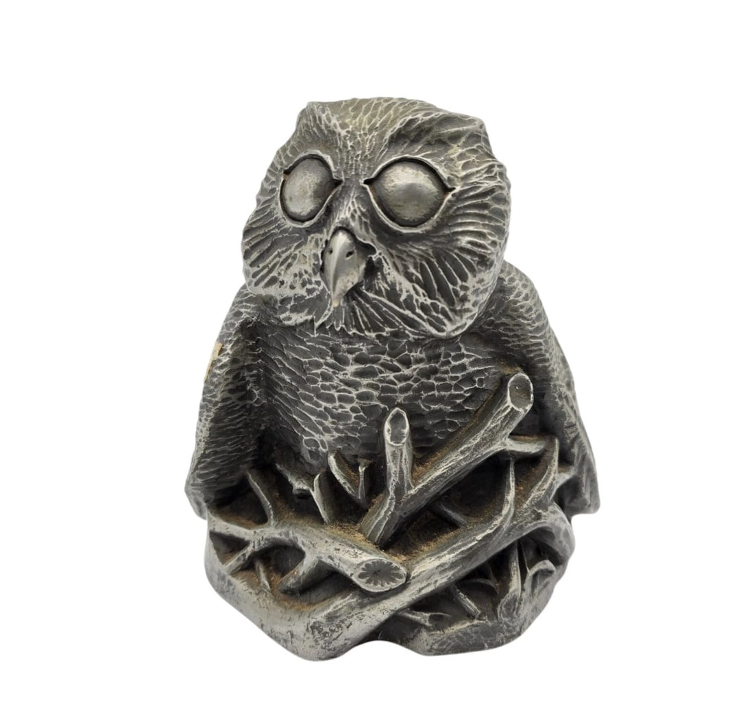 Owl Signed Richard Fisher 5 1/2" Tall Kirkby Stephen Westmoreland England: A solid, heavy vintage cast metal or pewter figurine depicting a stylized owl perched among rustic tree branches. The owl features heavily textured feathers, large expressive eyes, and a classic mid-c