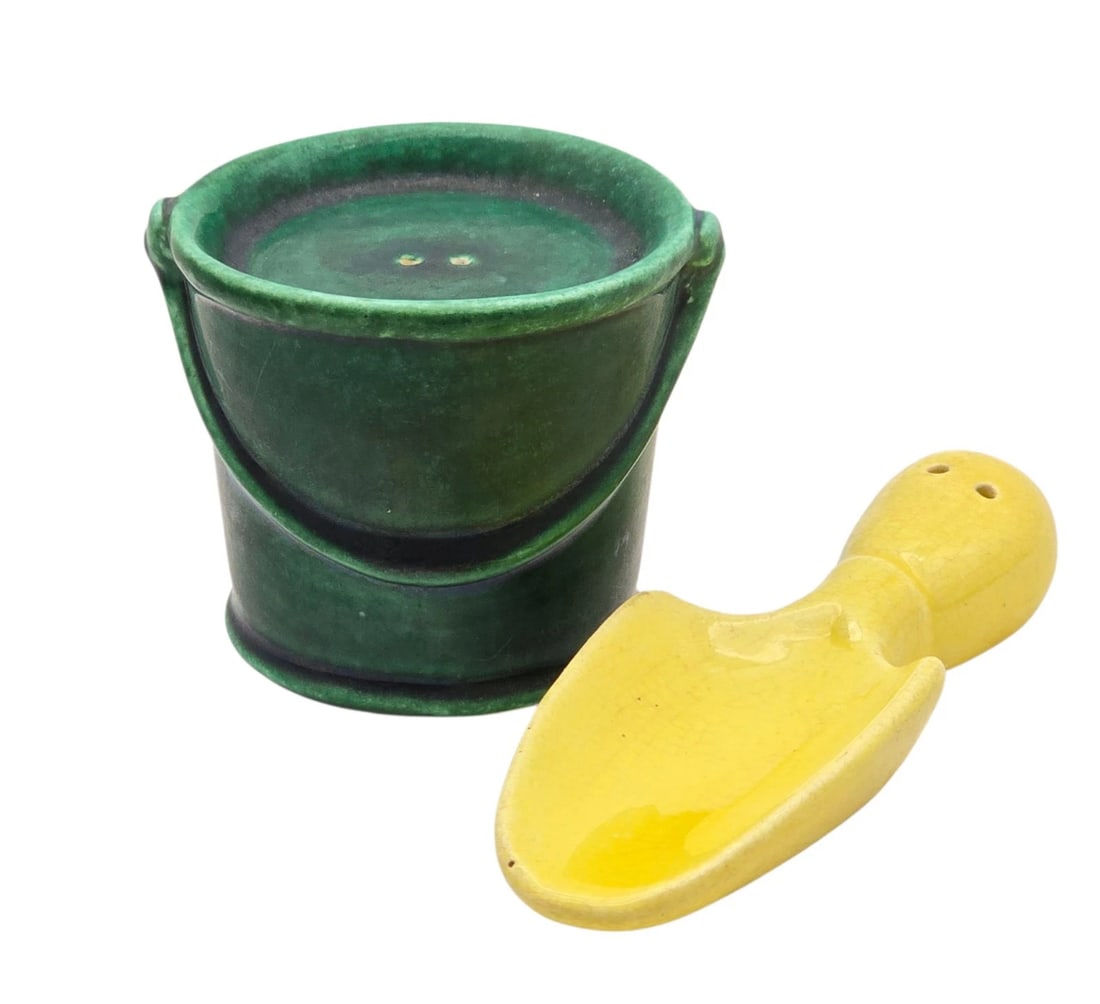 Vintage Gardening Salt & Pepper Shakers Bucket Trowel Yellow Green Ceramic: mid-century ceramic salt and pepper shaker set shaped like garden or beach toys. The set includes a deep forest green bucket (serving as one shaker) and a bright sunshine yellow hand trowel/shovel (se