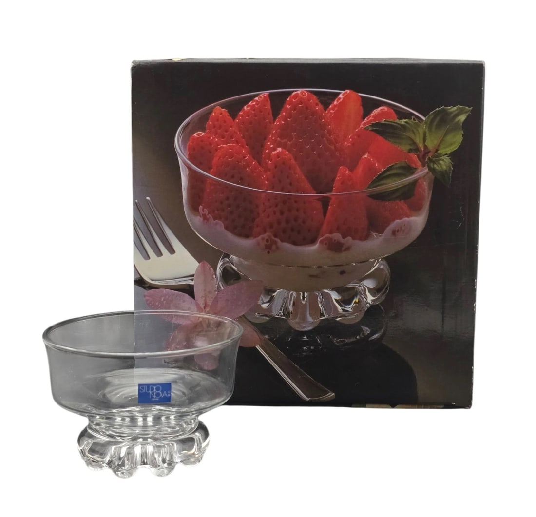 NIB Set of 4 Studio Nova Citadel Footed Dessert Cups: A beautiful clear crystal footed dessert or sherbet bowl by Studio Nova (includes original blue label and product box).SET OF 4 Features a sleek, modern flared bowl resting on a heavy, textured scallo