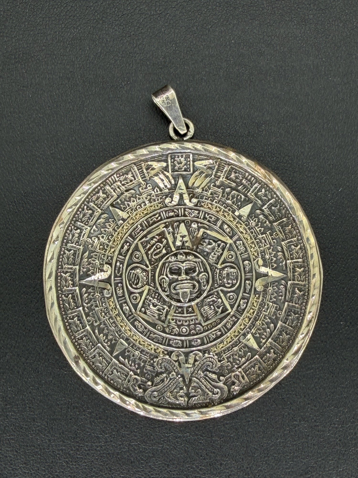 Pre-owned 925 Sterling Silver Aztec Calendar Pendant: 1. Pre-owned- 925 sterling silver Aztec calendar pendant2. All stamps hallmarks or markings are shown as received and are for reference purposes only. Verification is the sole responsibility of the bu