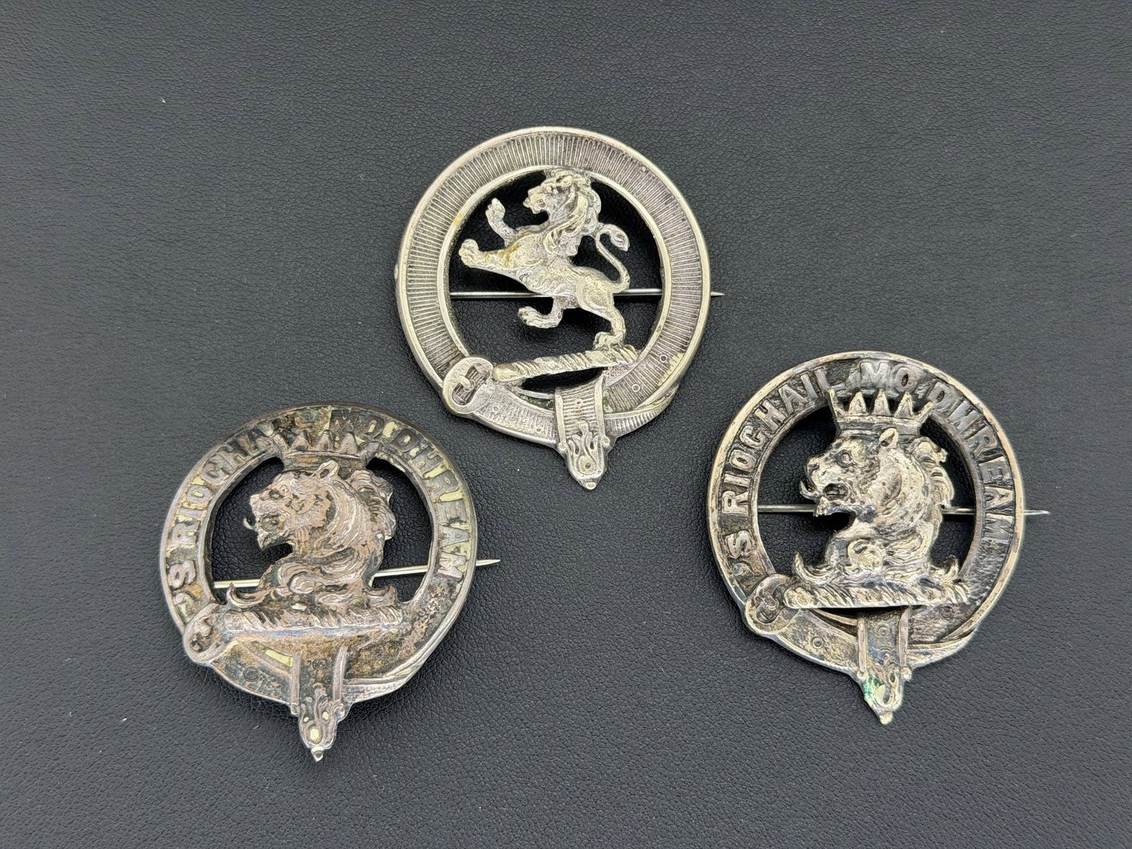 Pre-owned Lot Of (3) Vintage Silver Scottish Clan MacGregor & Lion Rampant Cap Badges / Bonnet: 1. Pre-owned- Lot of (3) Vintage Silver Scottish Clan MacGregor & Lion Rampant Cap Badges / Bonnet Brooches 2. All stamps hallmarks or markings are shown as received and are for reference purposes