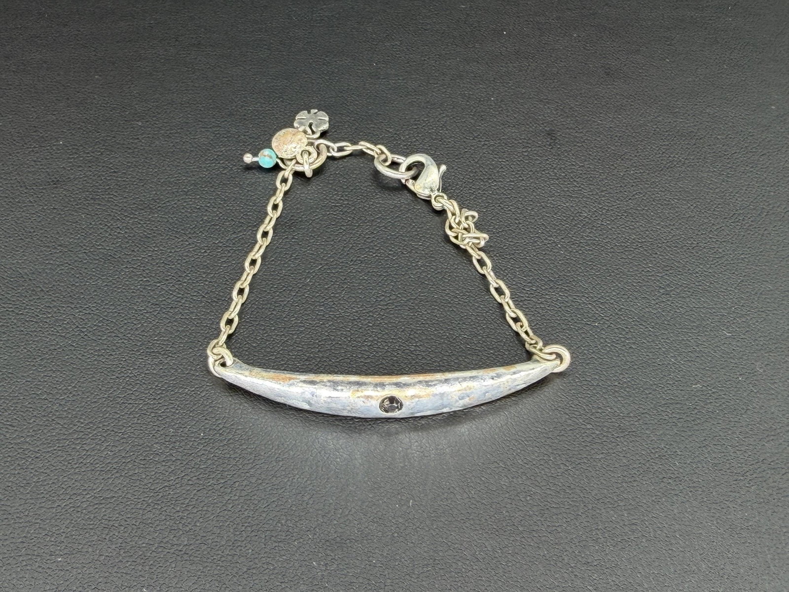Pre-owned Lucky Brand Silver Plated Curved Bar Bracelet: 1. Pre-owned- Lucky Brand Silver Plated Curved Bar Bracelet2. All stamps hallmarks or markings are shown as received and are for reference purposes only. Verification is the sole responsibility of the