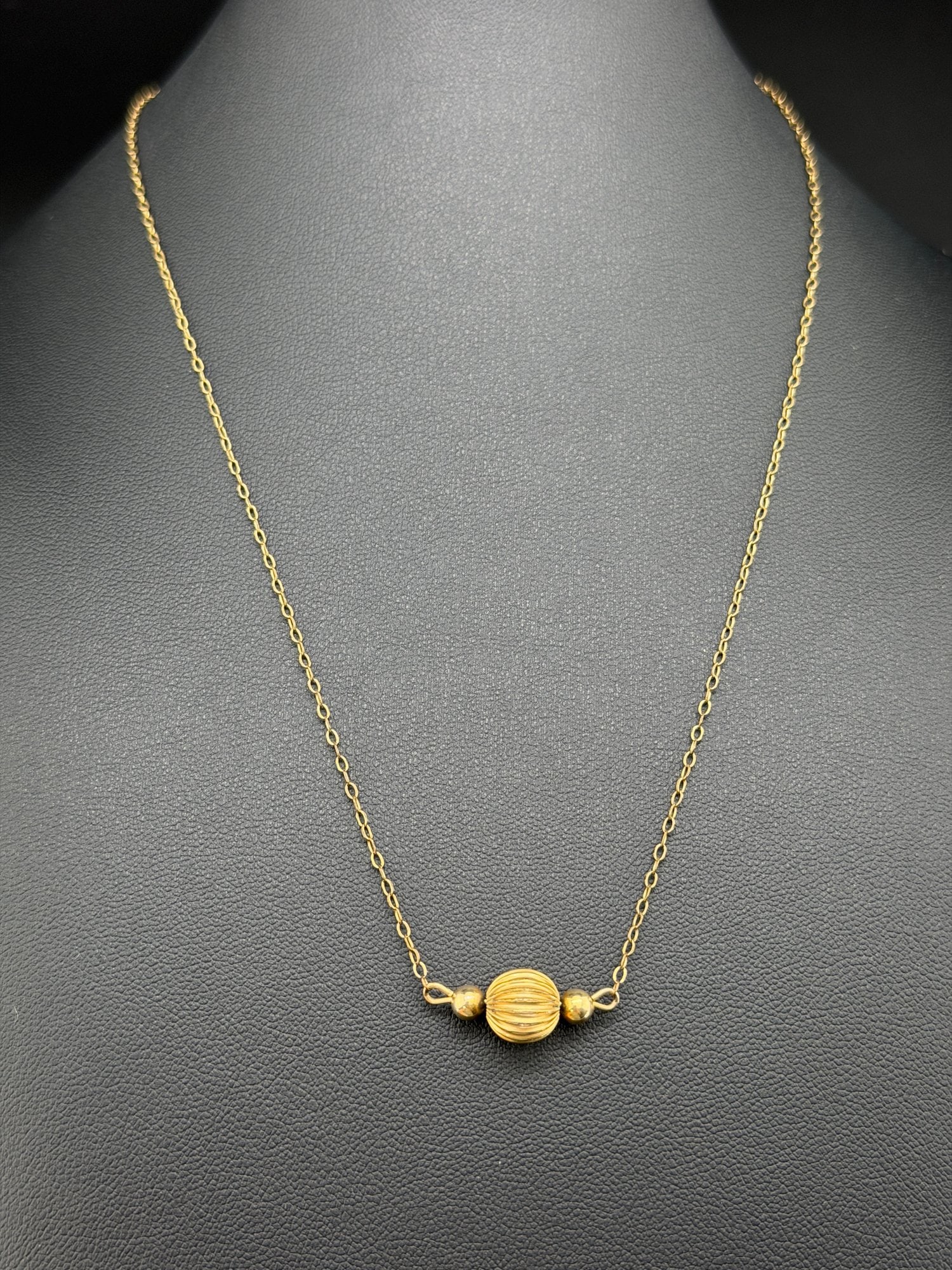 Pre-owned Vintage 14K Gold Filled Ribbed Bead Station Necklace: 1. Pre-owned- Vintage 14K Gold Filled Ribbed Bead Station Necklace2. All stamps hallmarks or markings are shown as received and are for reference purposes only. Verification is the sole responsibility