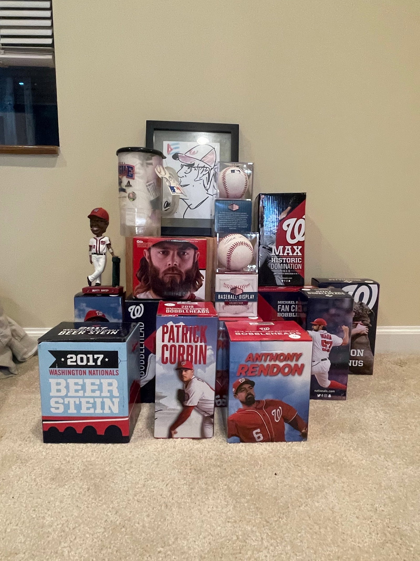 Washington Nationals Memorabilia Collection: This collection features various Washington Nationals baseball memorabilia, including bobbleheads of prominent players like Bryce Harper, Anthony Rendon, and Patrick Corbin, as well as a 2017