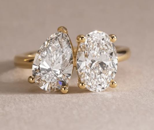5.00 Carat Oval And Pear Diamond Toi et Moi Engagement Ring in 14 kt Yellow Gold: 5.00 Carat Oval And Pear Diamond Toi et Moi Engagement Ring in 14 kt Yellow Gold Ring Us 7.00 us Ring Size change available