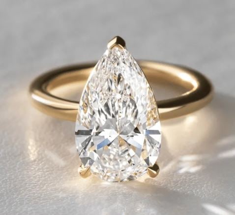 4.60 Carat Lab Grown Pear Diamond Solitaire Engagement Ring in 14 kt Yellow Gold: 4.60 Carat Lab Grown Pear Diamond Solitaire Engagement Ring in 14 kt Yellow Gold Us 7.00 us Ring Size change available