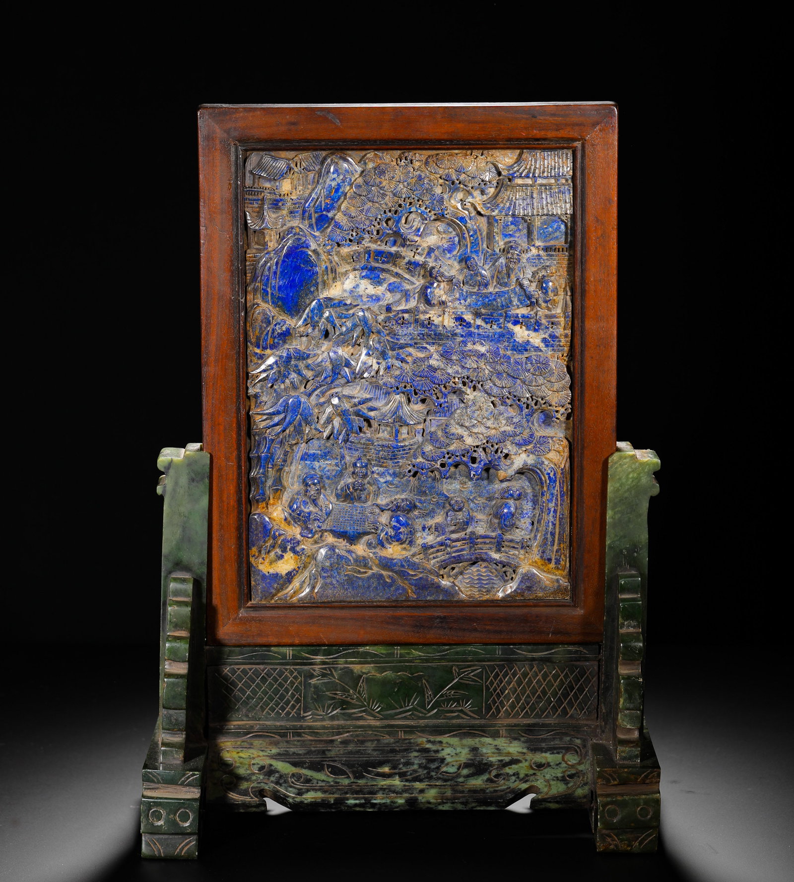 QING DYNASTY LAPIS LAZULI CARVED "XIYUAN YA JI" FIGURE PATTERN SCREEN: H:43cmW:29.3cmWeight:6620gA Qing Dynasty table screen with a lapis lazuli panel carved with scholars gathering, mounted on a spinach jade stand, a fine scholar's display piece.