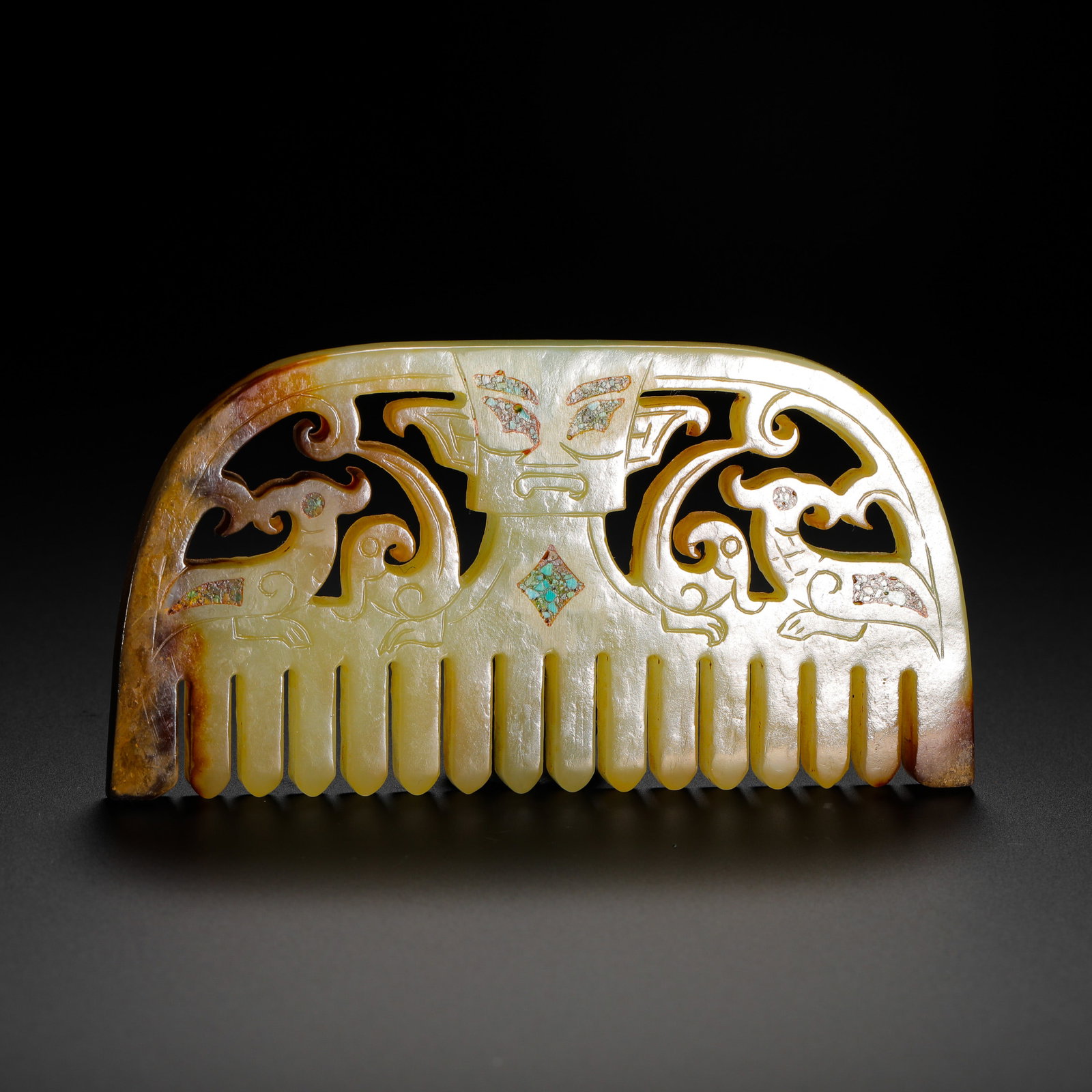 A COMB MADE OF HETIAN YELLOW JADE INLAID WITH TURQUOISE PATTERNS FROM THE SHANG DYNASTY (1 of 8)
