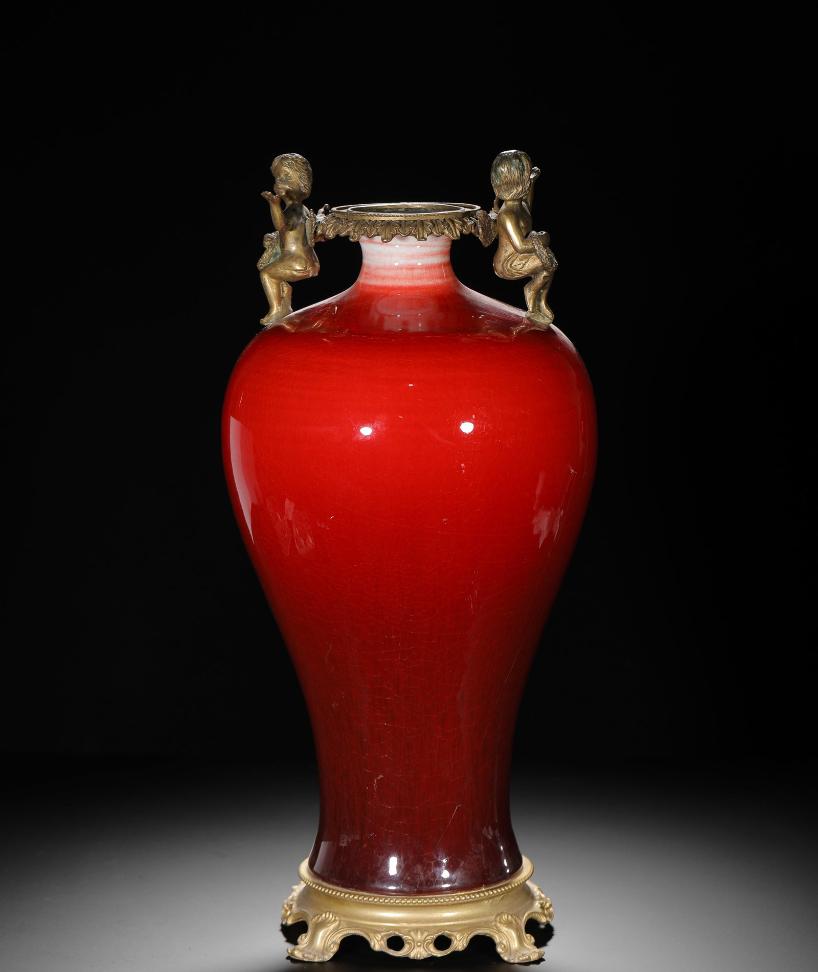 QING DYNASTY LANG KILN RED GLAZED COPPER INLAID PLUM VASE: H:50cmW:21cmWeight:6300g Qing export decorative porcelain in classic plum vase shape, fully covered with Langyao red glaze with fine crackle. Mounted with European gilded bronze ornaments on rim, cher
