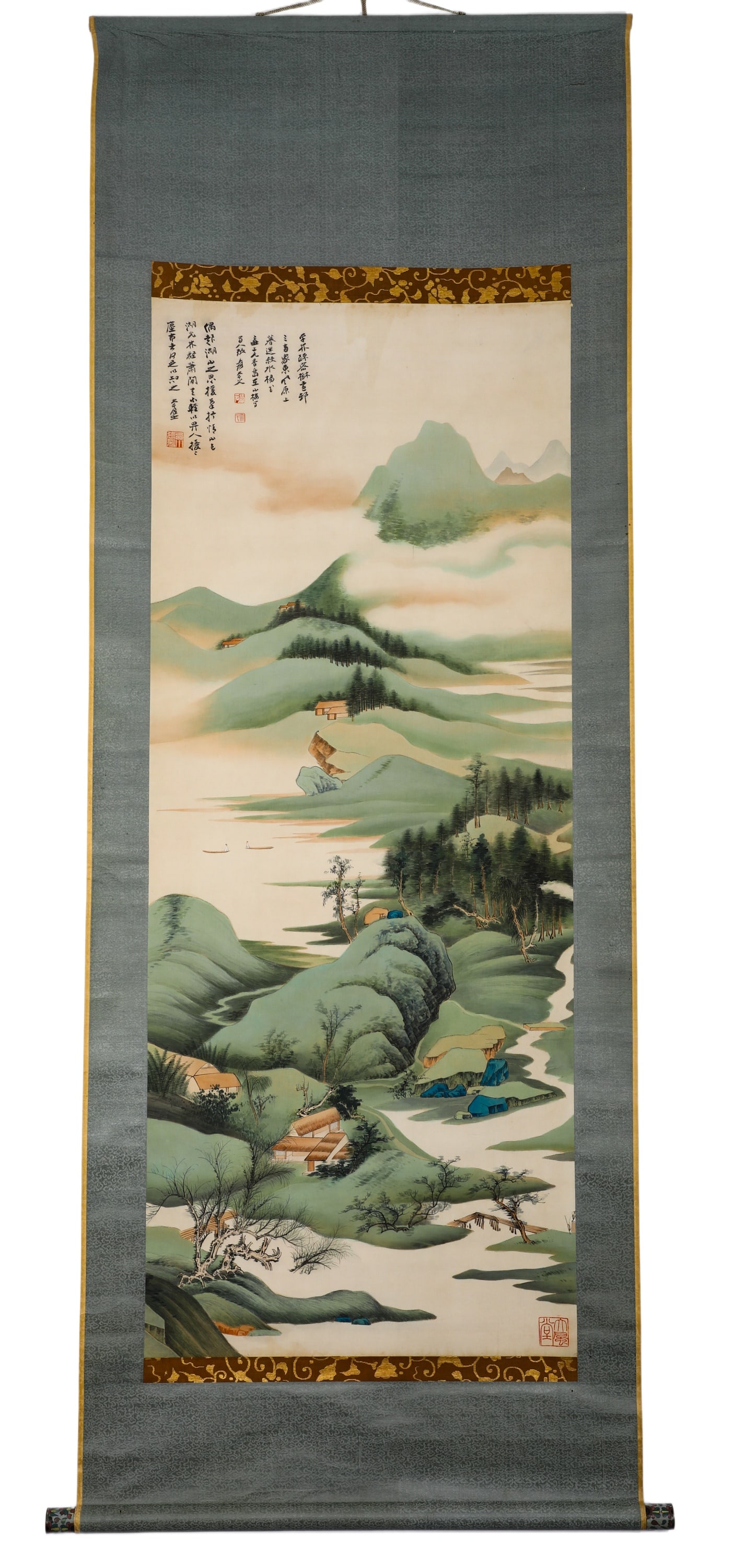 ZHANG DAQIAN (1899-1983) LAKE AND MOUNTAIN PLAIN, ORIGINAL SILK MOUNTING, VERTICAL SCROLL: H:153cm (60.24in) W:62cm (24.41in)Light green landscape scroll on silk with antique two-tone grey silk and brocade mounting. It depicts a peaceful distant lake scenery with layered green hills, stream