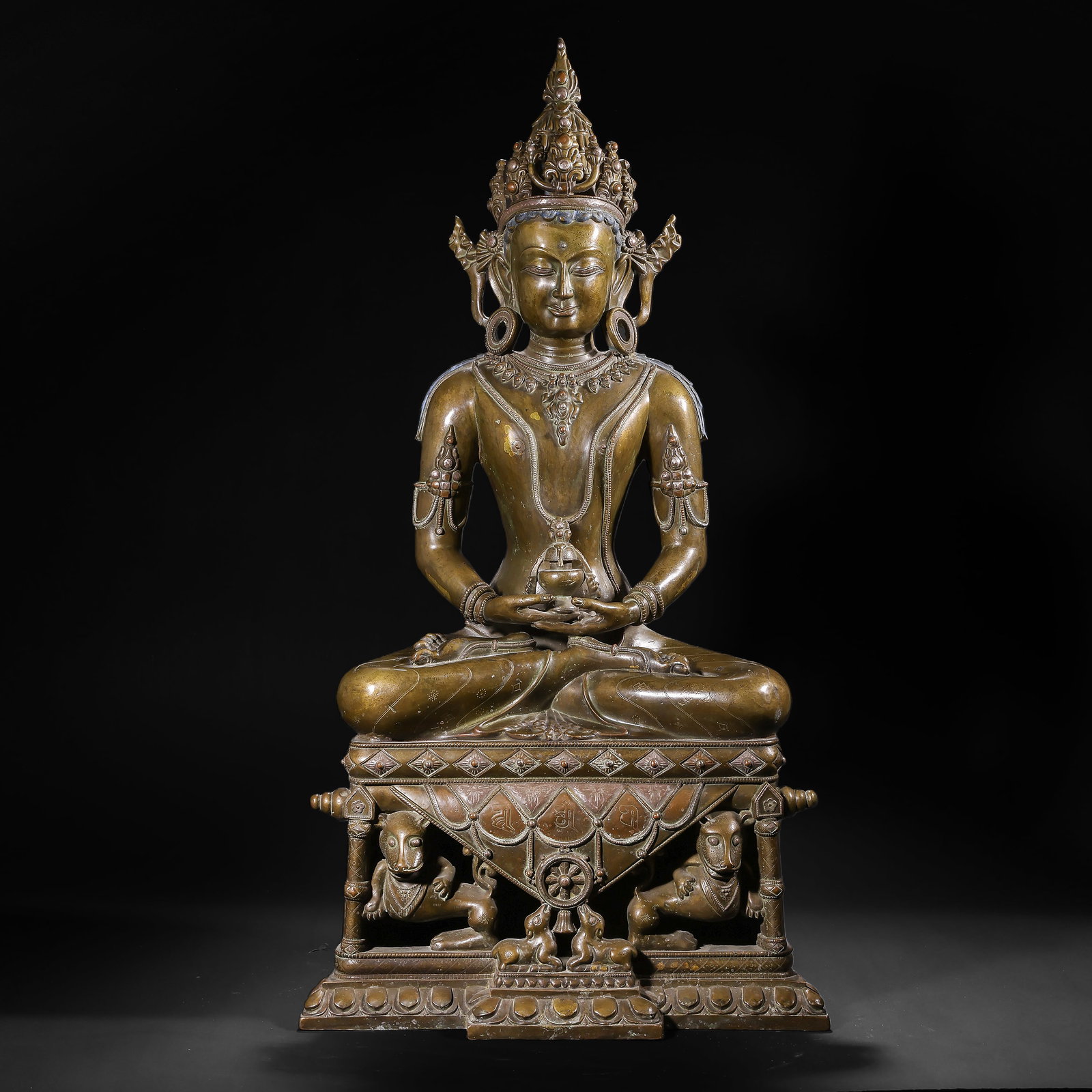 BRONZE INLAID SILVER SEATED STATUE OF AMITABHA BUDDHA FROM THE QING DYNASTY: H:75.0cm(29.53in) W:39.0cm(15.35in) Weight:22050g(48.61lb)This statue is cast in bronze. Amitayus sits in the full-lotus posture on a Sumeru-style pedestal, wearing a five-leaf treasure crown with a c