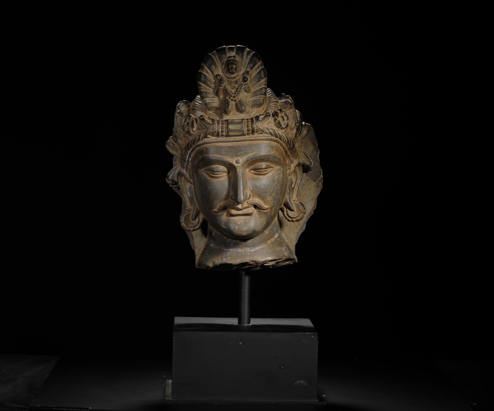 A 3RD CENTURY STONE-CARVED GANDHARA HEAD: H:50cm (19.69in) H:30cm (11.81in) W:cm Weight:18890g (41.65lb)