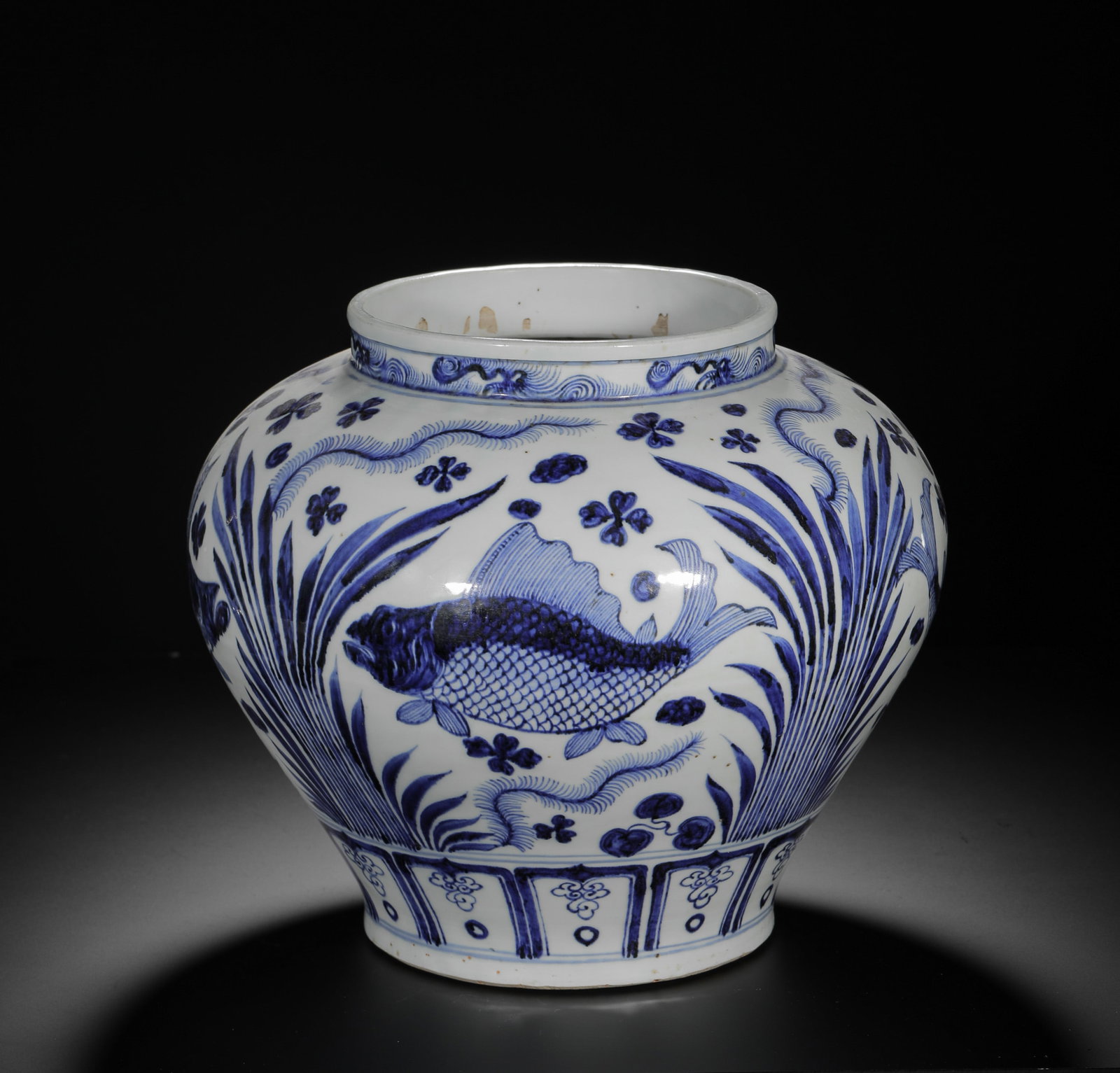 YUAN BLUE AND WHITE FISH AND ALGAE PATTERN LARGE JAR: H:26cm (10.24in) D:31cm (12.20in) Weight:3810g (8.40lb)This is a Yuan Dynasty porcelain jar from the Jingdezhen Kiln. Covered in a white glaze with a slight blue tint, the exterior is decorated with f