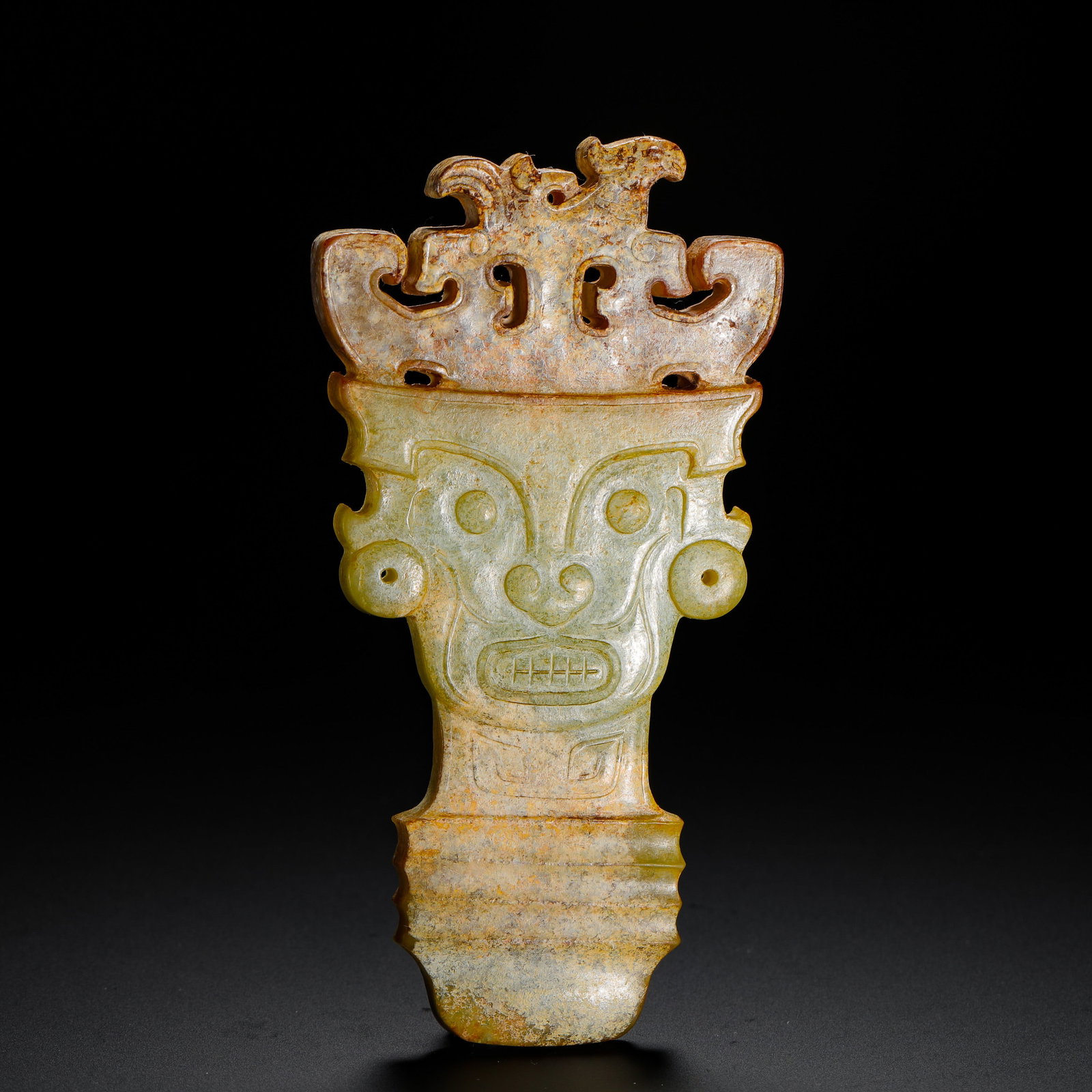 HETIAN JADE ANCESTRAL FACE PENDANT FROM THE SHANG AND ZHOU DYNASTIES: H:10.4cm (4.09in) W:5.4cm (2.13in) Weight:80g (0.18lb)