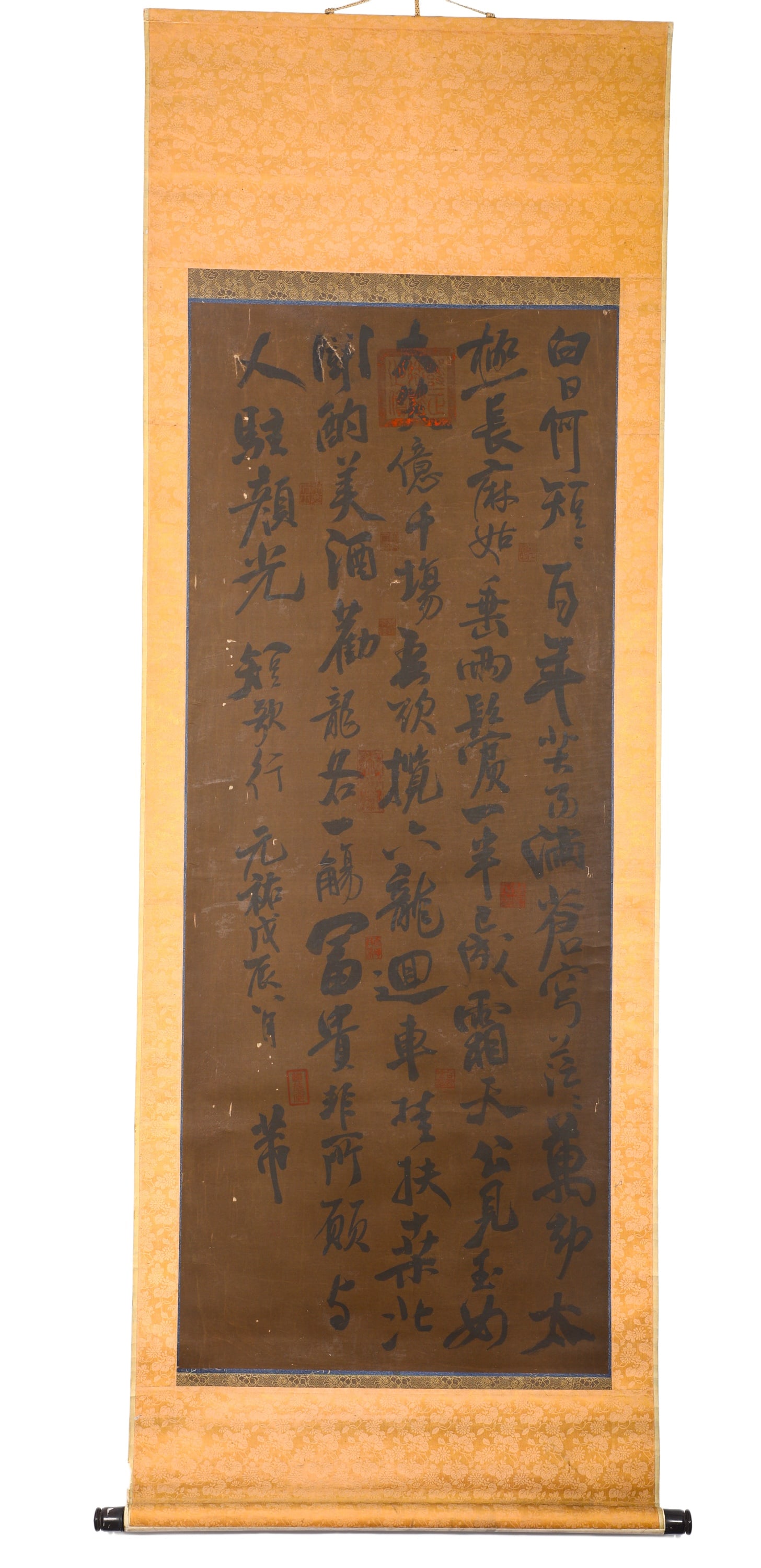 MI FU OF THE SONG DYNASTY (1051-1107) RUNNING SCRIPT "SHORT SONG" ANCIENT SILK SCROLL: H:134cm (52.76in) W:54cm (21.26in)Running script calligraphy scroll on aged dark brown silk mounted with golden patterned silk brocade, with thick aged ink. The whole piece transcribes verses of Short