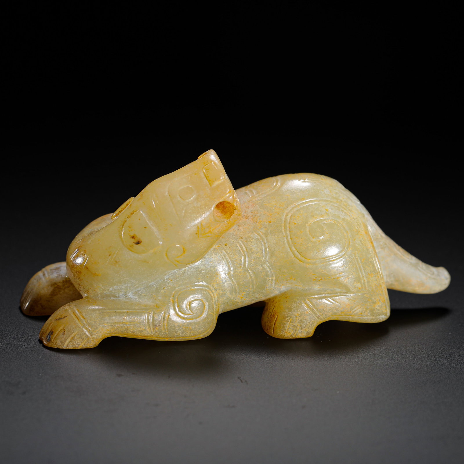 HETIAN JADE AUSPICIOUS BEAST OF THE SHANG DYNASTY: H:4.5cm (1.77in) W:9cm (3.54in) Weight:110g (0.24lb)