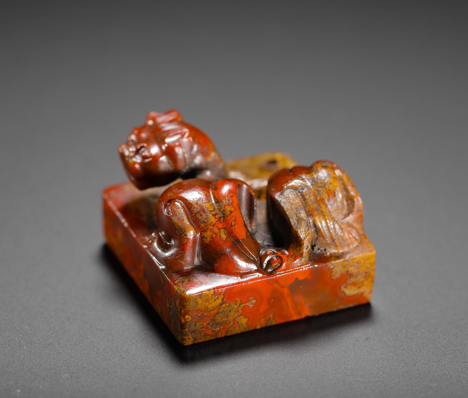 RED ONYX COILED DRAGON BUTTON SQUARE SEAL FROM THE WARRING STATES PERIOD (1 of 6)