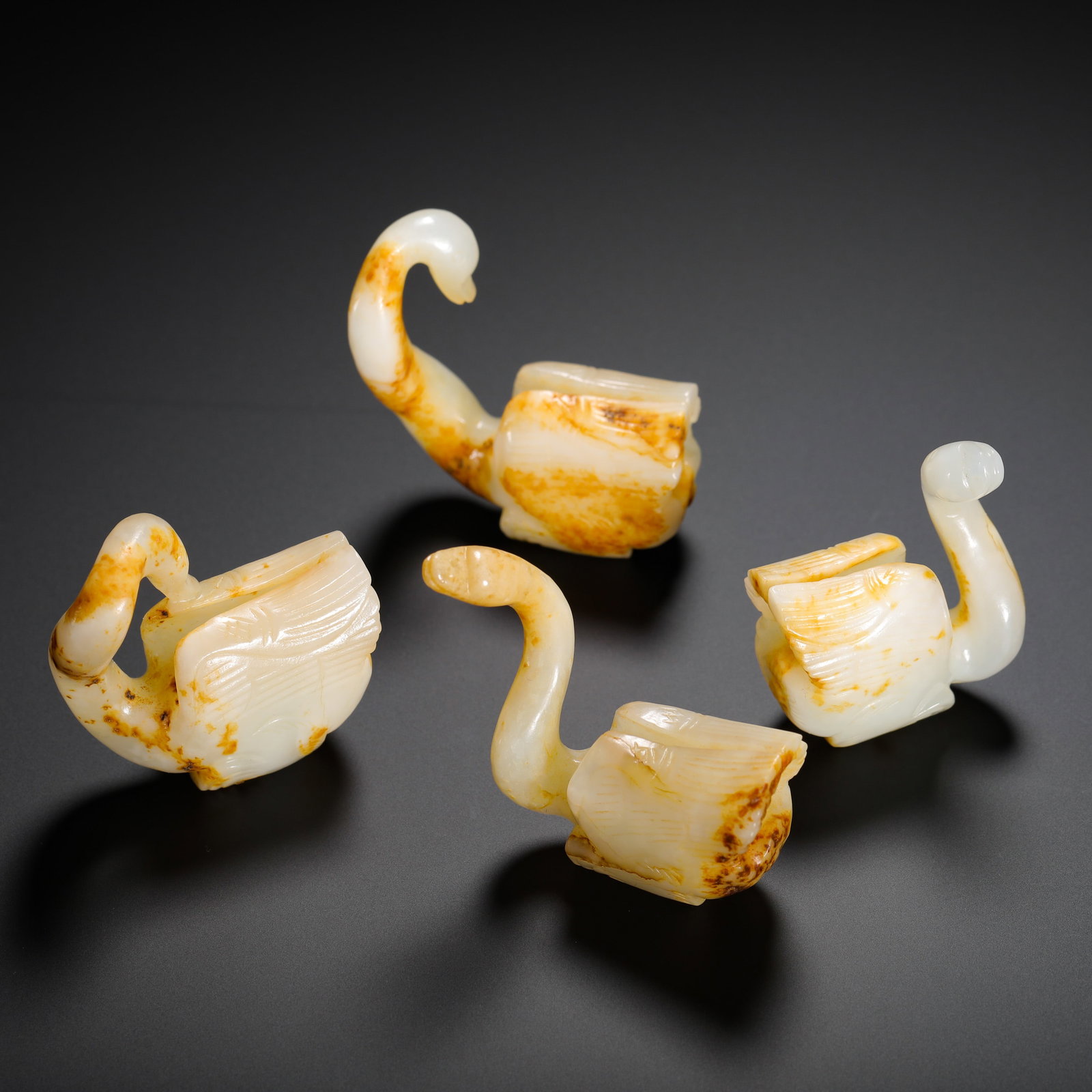 A SET OF HAN DYNASTY HETIAN JADE SWANS: H:5.5cm (2.17in) W:5cm (1.97in) Weight:140g (0.31lb)