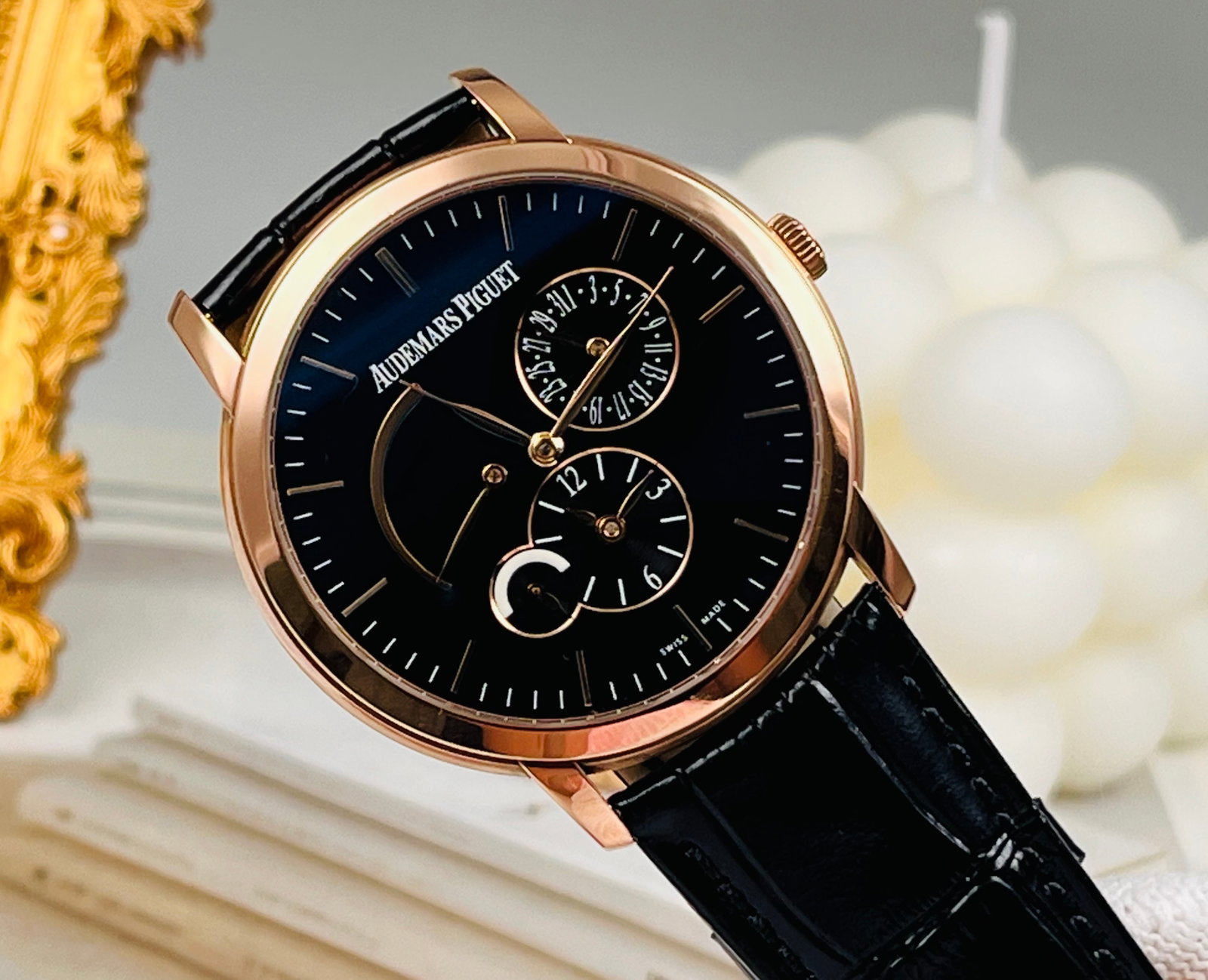AUDEMARS PIGUET 18K ROSE GOLD WATCH: 41mm case with?? hour markers and hands, 12 o'clock day-of-the-week display, 6 o'clock small seconds subdial and moon phase indicator, featuring an elegant and refined layout that exudes sophisticatio
