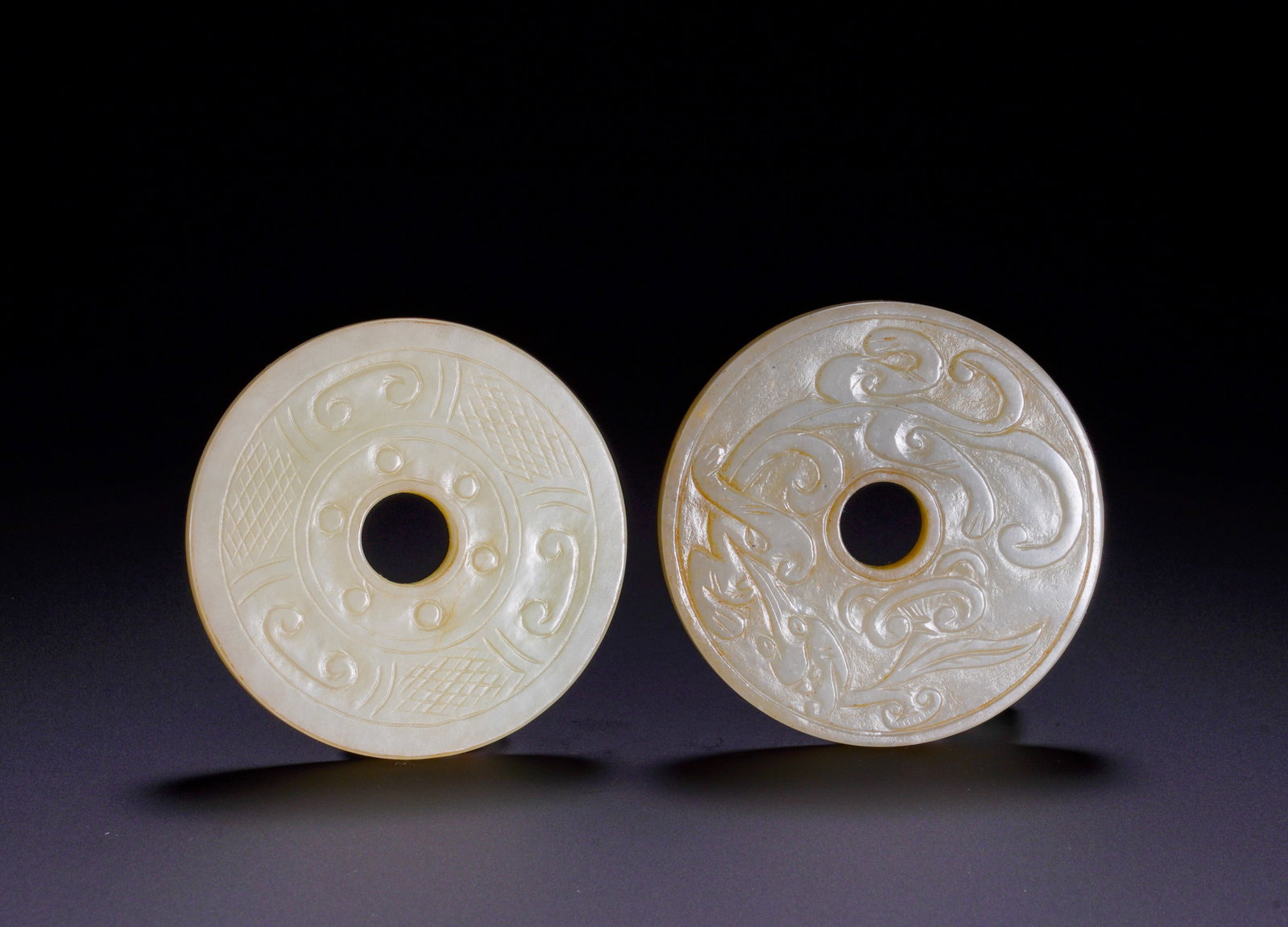 TWO PIECES OF HAN DYNASTY JADE DISCS IN A SET