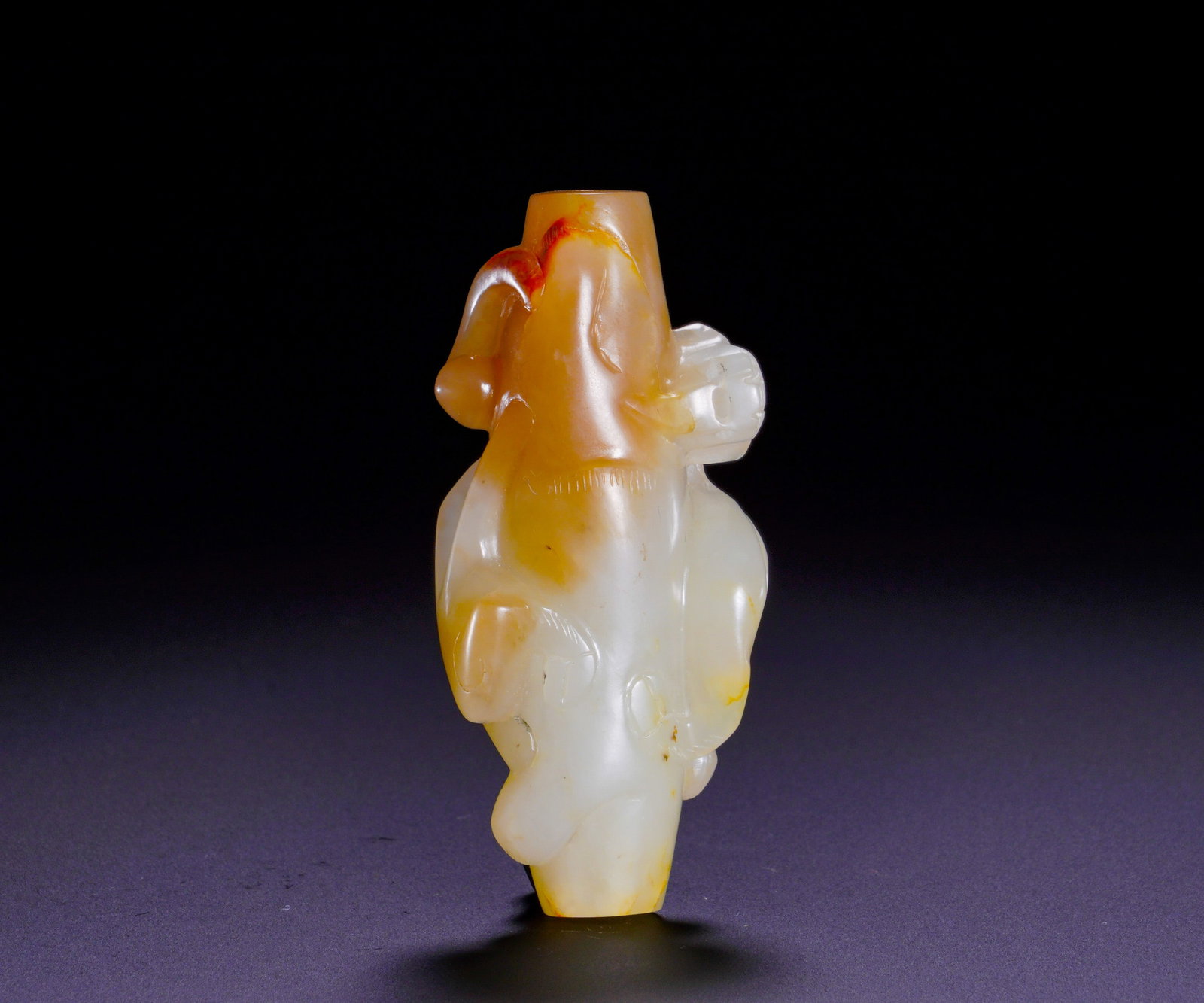 HAN DYNASTY HETIAN JADE CHILONG-PATTERNED LEZI: Height:7cm(2.76in)Width:3.3cm(1.30in)Weight:50g(0.11lb)Han Dynasty Hetian jade tube bead carved with chilong dragon.The pale white jade is naturally suffused by yellowish-brown patina. The cylindrical