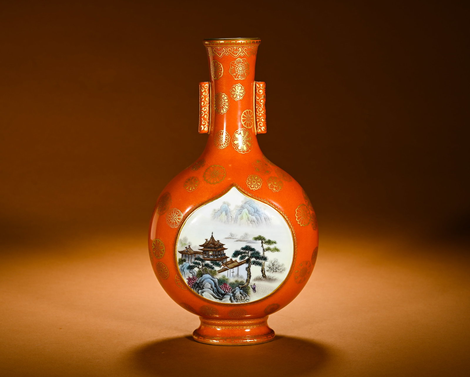 CORAL RED GROUND WITH GILDED AND POLISHED PASTEL LANDSCAPE PATTERN THROUGH-EAR VASE